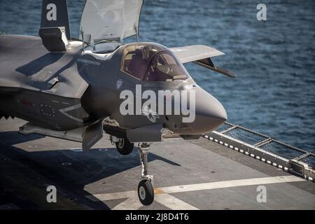 A U.S. Marine Corps F-35B Lightning II fighter aircraft, attached to the Wake Island Avengers of Marine Attack Squadron 211, prepares to take off from the flight deck of the Wasp-class amphibious assault ship USS Essex, March 24, 2021 operating on the Pacific Ocean. Stock Photo