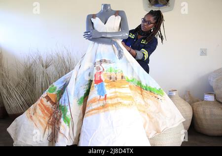 (220515) -- BULAWAYO, May 15, 2022 (Xinhua) -- Nkanyeziyethu Malunga, a fashion designer, shows one of her works in Bulawayo, Zimbabwe, on April 26, 2022. TO GO WITH 'Feature: Zimbabwean designer celebrates tradition through fashion' (Photo by Shaun Jusa/Xinhua) Stock Photo