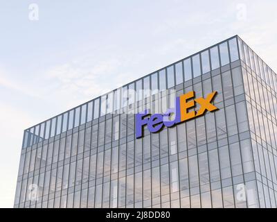 Memphis, TN, USA. May 2, 2022. Editorial Use Only, 3D CGI. FedEx Signage Logo on Top of Glass Building. Shipping Transport Company in High-rise Office Stock Photo