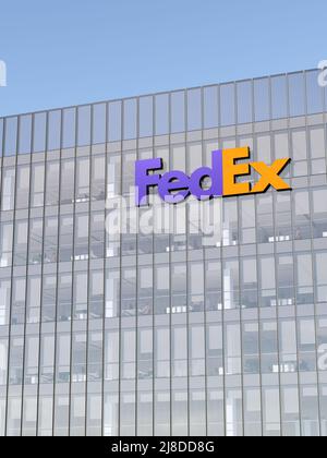 Memphis, TN, USA. May 2, 2022. Editorial Use Only, 3D CGI. FedEx Signage Logo on Top of Glass Building. Shipping Transport Company in High-rise Office Stock Photo