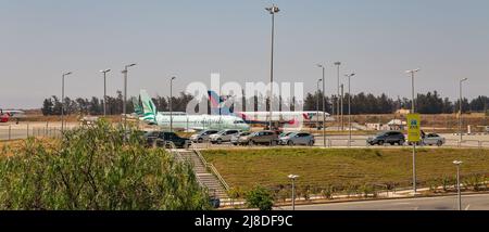 Larnaca, Cyprus - May 31, 2021: Cyprus Airways and Azur Air airplanes in Glafcos Clerides Larnaca international airport. Larnaca is the third-largest Stock Photo