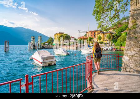 Beautiful blonde girl in Varenna, the Lombard village of lovers on Lake Como Stock Photo