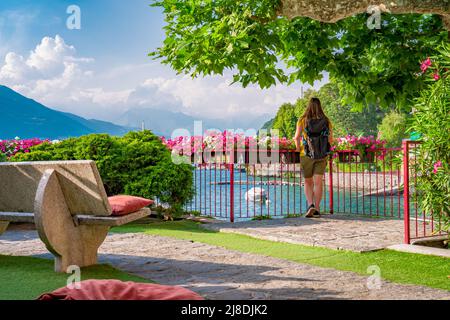 Beautiful blonde girl in Varenna, the Lombard village of lovers on Lake Como Stock Photo