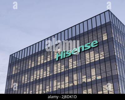 Qingdao, China, USA. May 2, 2022. Editorial Use Only, 3D CGI. Hisense Signage Logo on Top of Glass Building. Workplace of Electronics Company Office H Stock Photo