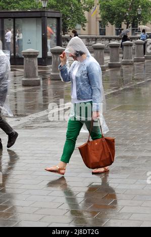 London, UK. 15th May, 2022. West end busy on wet weekend. Credit: JOHNNY ARMSTEAD/Alamy Live News Stock Photo