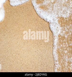 Soft sea waves on sand with copy space​. Abstract background. Design for backdrop or billboard. Selective focus. Stock Photo