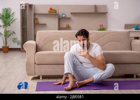 Young man doing sport exercises in the morning Stock Photo