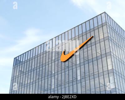 Beaverton, OR, USA. May 2, 2022. Editorial Use Only, 3D CGI. Nike Signage Logo on Top of Glass Building. Workplace Multinational Sportswear Company Of Stock Photo