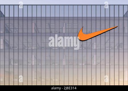 Beaverton, OR, USA. May 2, 2022. Editorial Use Only, 3D CGI. Nike Signage Logo on Top of Glass Building. Workplace Multinational Sportswear Company Of Stock Photo