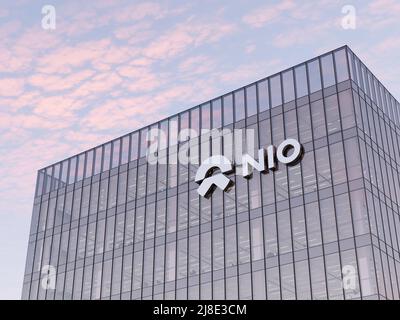 Shanghai, China. May 2, 2022. Editorial Use Only, 3D CGI. NIO Company Signage Logo on Top of Glass Building. Workplace Electric Vehicles Automaker Off Stock Photo