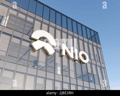 Shanghai, China. May 2, 2022. Editorial Use Only, 3D CGI. NIO Company Signage Logo on Top of Glass Building. Workplace Electric Vehicles Automaker Off Stock Photo