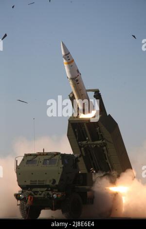 A U.S. Army M57A1 Tactical Missile System missile  is launched from a M270A1 Multiple Launching Rocket System launcher or ATACMS, June 14, 2012 at White Sands Missile Range, New Mexico. Stock Photo