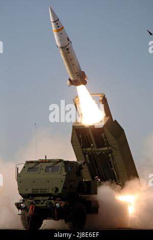 A U.S. Army M57A1 Tactical Missile System missile  is launched from a M270A1 Multiple Launching Rocket System launcher or ATACMS, June 14, 2012 at White Sands Missile Range, New Mexico. Stock Photo