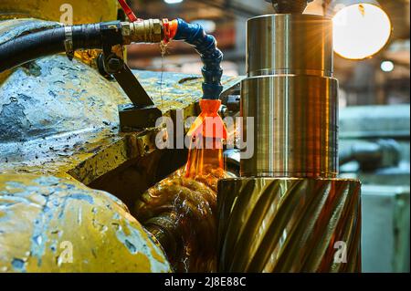 Processing helical gear with old modular hob machine tool Stock Photo