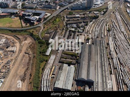 Cape Town, South Africa. 2022. Aerial view of trains and the railway tracks  in the south east district of Cape Town. Stock Photo