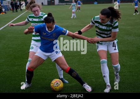 Glasgow, UK. 15th May, 2022. Kayla McCoy (Rangers) holds off Tegan Bowie (Celtic) and Cheyenne Shorts (Celtic) during the Scottish Women's Premier League 1 match between Celtic and Rangers at Petershill Park in Glasgow, Scotland. Scottish Women's Premier League 1 Alex Todd/SPP Credit: SPP Sport Press Photo. /Alamy Live News Stock Photo