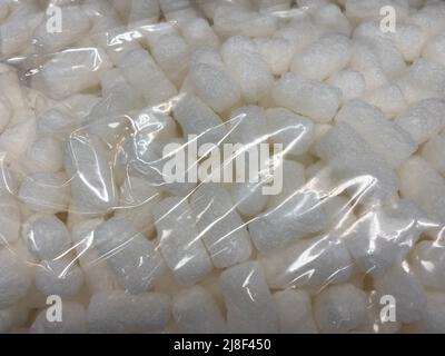 packing protection air pop corn filler in a plastic bag Stock Photo