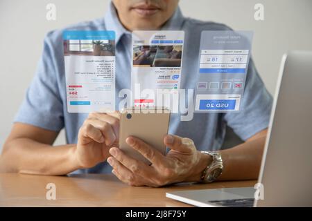 Man in casual cloth interacting with futuristic virtual screen of hotel reservation and travel planning application Stock Photo