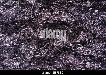 Abstract texture pattern metallic paper using as a background or wallpaper. Metal aluminum foil shiny and reflector. High quality photo Stock Photo