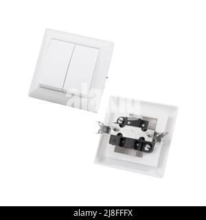 Built-in light switch with 2 keys isolated on a white background. Photograph of the switch front and back. Stock Photo