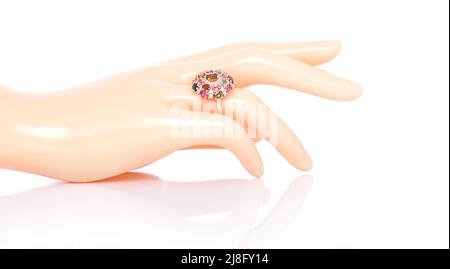 Tourmaline and Diamond Jewel or gems ring on plastic mannequin female finger. Collection of natural gemstones accessories. Studio shot Stock Photo