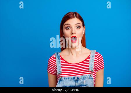 Photo of shocked pretty person open mouth look camera speechless isolated on blue color background Stock Photo