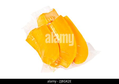 Packed pumpkin slices on an isolated white background Stock Photo