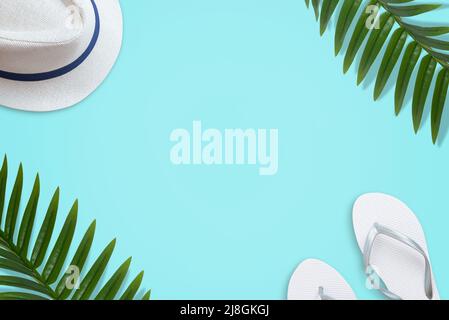 Summer travel flat lay background with hat, slippers and palm leaves Stock Photo