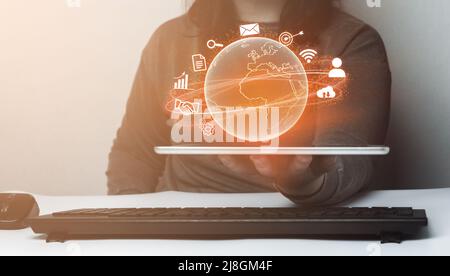 Young woman showing tablet with virtual global Internet connection. Technology and digital marketing. Financial and banking. Big data. Stock Photo