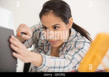 young attractive female digital electronic engineer testing computer pc Stock Photo