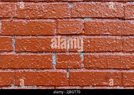 background in the form of brickwork with painted red paint. High quality photo Stock Photo