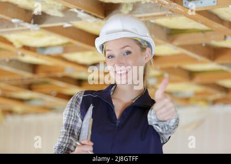 woman engineer supervisor shows thumb up Stock Photo