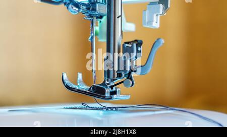 Sewing machine parts close-up - foot and needle Stock Photo