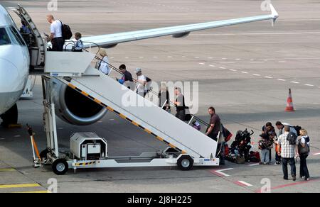 passengers boarding a commercial jet plane, Berlin, Germany
