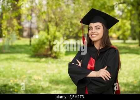 Female College Graduate in Cap and Gown Stock Photo - Image of face,  mortarboard: 14973072