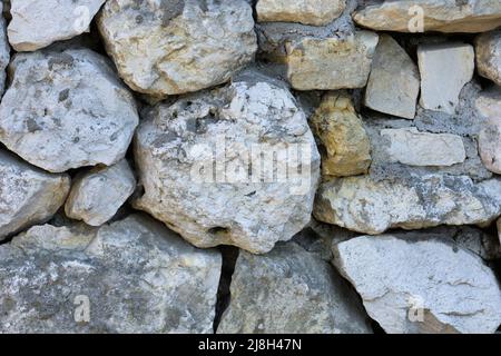 Limestone wall with rocky structure Stock Photo