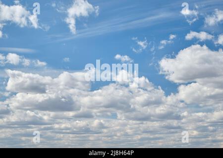 Clear blue sky and white clouds in summer during the daytime. Stock Photo
