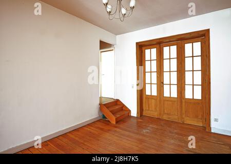 Interior aged wooden door with glasses frames in empty room Stock Photo