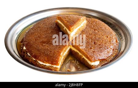 Bread kadayif isolated on a white background. Sliced bread kadayif in a tray. local name Stock Photo
