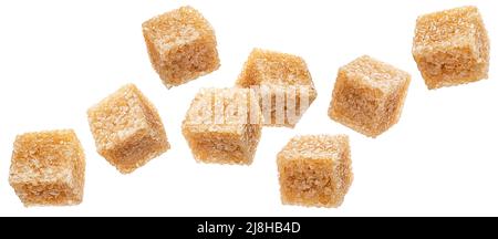 Falling cubes of cane sugar isolated on white background Stock Photo