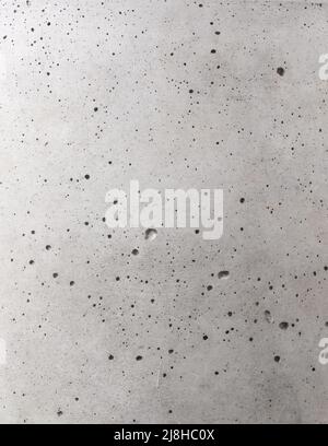 grey concrete wall surface with porous, empty full frame background texture, top down view, flat lay, photography backdrop Stock Photo