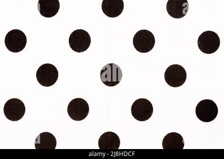 Black polka dot over white fabric background. High quality texture. Stock Photo
