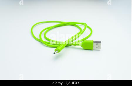 Green USB cable for smartphone isolated on white background Stock Photo