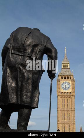Back Of The Bronze Sculpture Statue Of Sir Winston Churchill With Walking Stick Looking Towards The queen Elizabeth Tower And Big Ben In Parliament Sq Stock Photo
