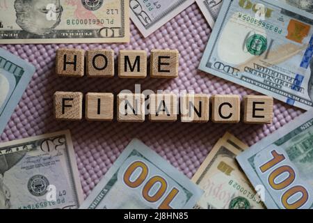 Home finance inscription on wooden cubes and cash Stock Photo