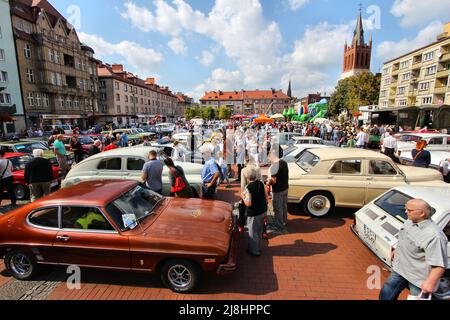 BYTOM, POLAND - SEPTEMBER 12, 2015: Visitors admire classic oldtimer cars during 12th Historic Vehicle Rally in Bytom. The annual vehicle parade is on Stock Photo
