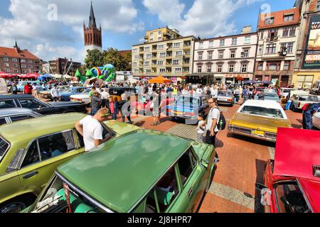 BYTOM, POLAND - SEPTEMBER 12, 2015: Visitors admire classic oldtimer cars during 12th Historic Vehicle Rally in Bytom. The annual vehicle parade is on Stock Photo