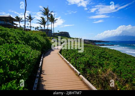 Oneloa Beach along the Kapalua Coastal Trail on West Maui, Hawaii - Boardwalk winding between luxury resorts and the Pacific Ocean Stock Photo