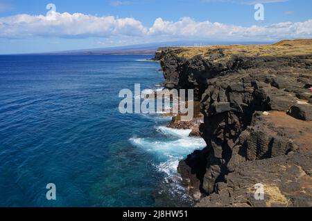 Volcanic cliffs in South Point Park, the southernmost point of the United States on the Big Island of Hawaii in the Pacific Ocean Stock Photo