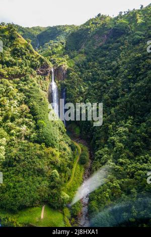 Aerial view of Manawaiopuna waterfall aka Jurassic Falls in Hanapepe Valley in the center of Kauai island, Hawaii